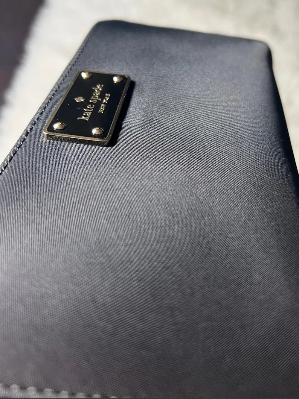 kate spade Black Zip-Around Logo Plate Wallet